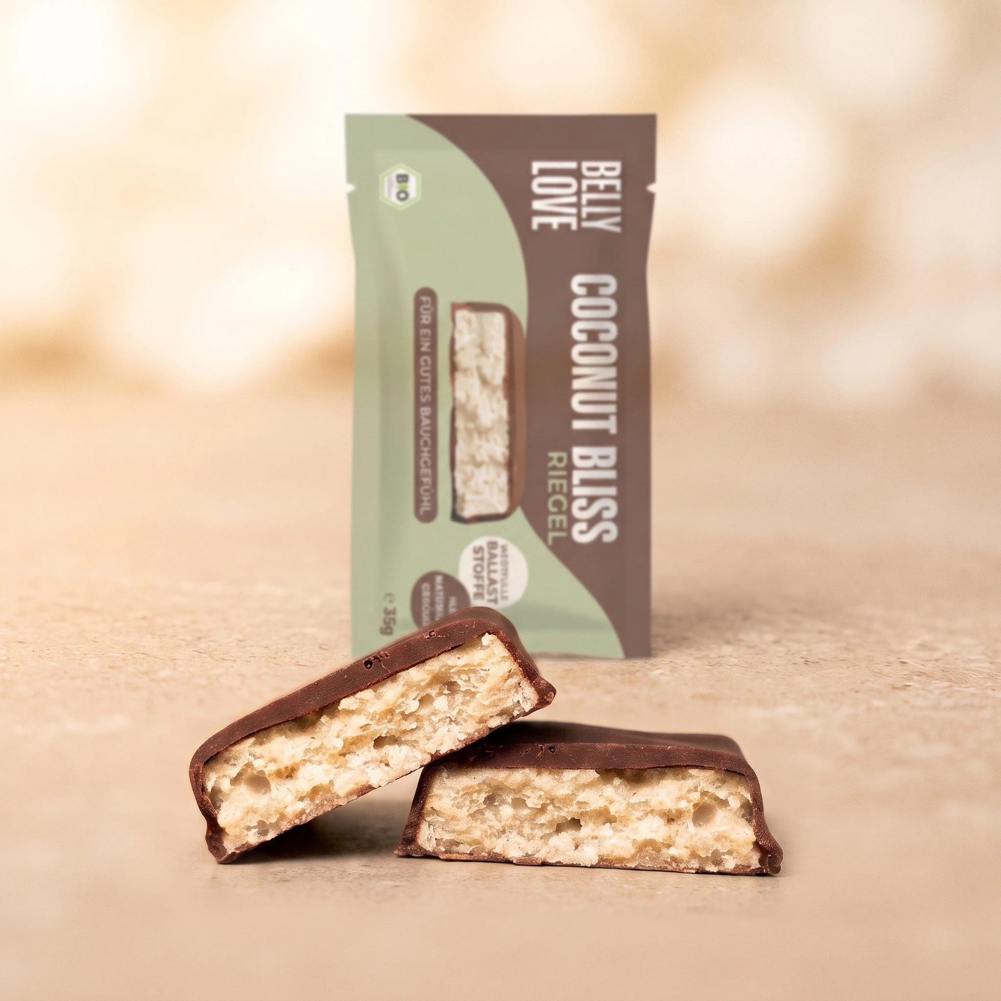 Coconut Bliss Riegel mit Verpackung. Dunkle Schoko und Kokos
